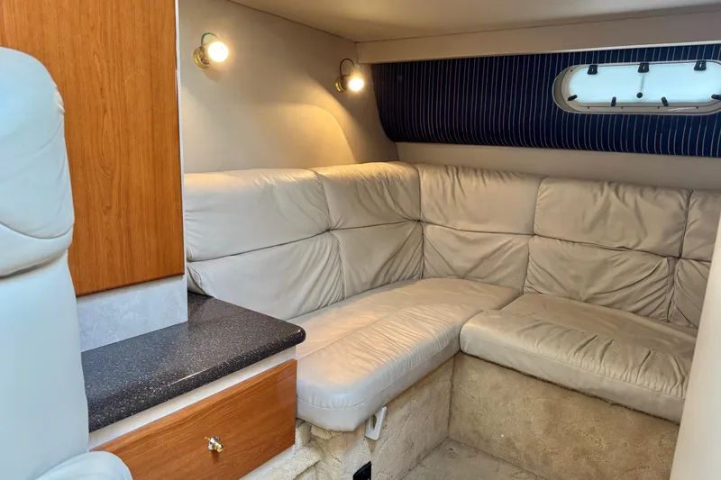  Yacht Photos Pics 2003 Formula 37 Performance Cruiser interior with beige leather seating and wooden cabinetry.
