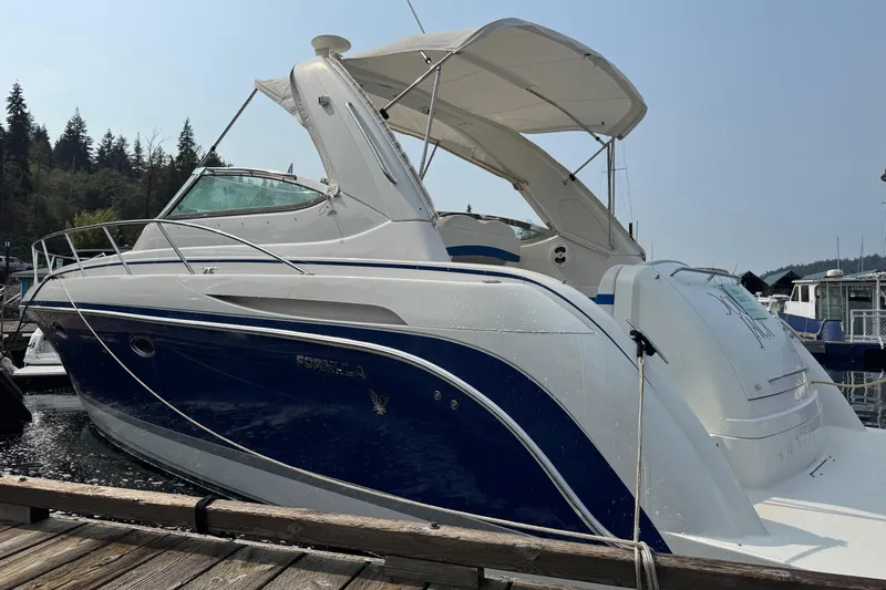  Yacht Photos Pics 2003 Formula 37 Performance Cruiser docked at marina, featuring sleek blue and white design.