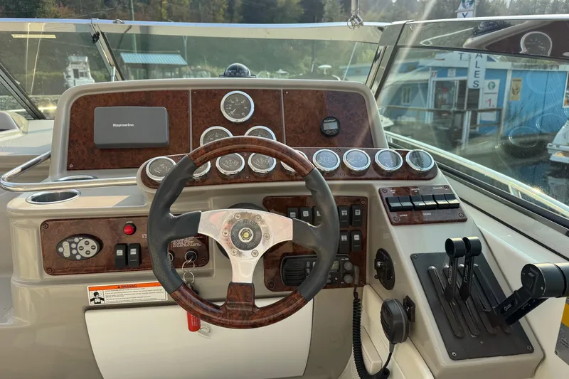  Yacht Photos Pics Steering console of a 2003 Formula 37 Performance Cruiser with gauges and controls.