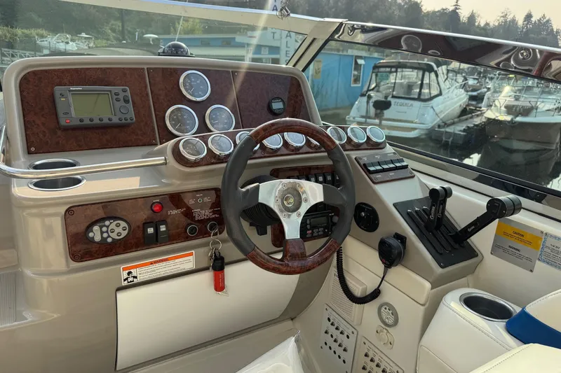  Yacht Photos Pics 2003 Formula 37 Performance Cruiser helm with gauges, controls, and steering wheel at marina.