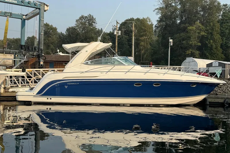  Yacht Photos Pics 2003 Formula 37 Performance Cruiser docked at marina, reflecting on calm water.