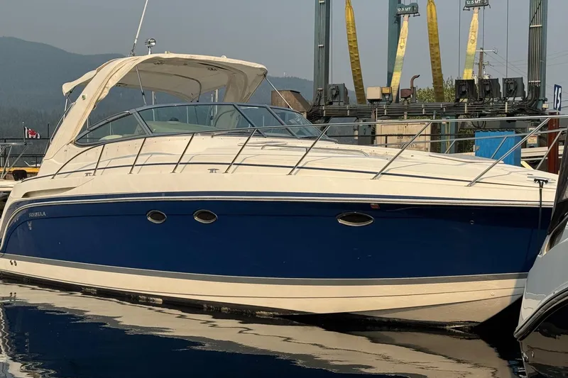  Yacht Photos Pics 2003 Formula 37 Performance Cruiser docked at marina, featuring sleek blue and white design.