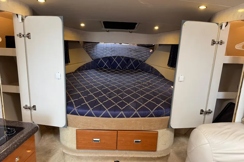  Yacht Photos Pics Interior of 2003 Formula 37 Performance Cruiser with cozy bed and storage cabinets.