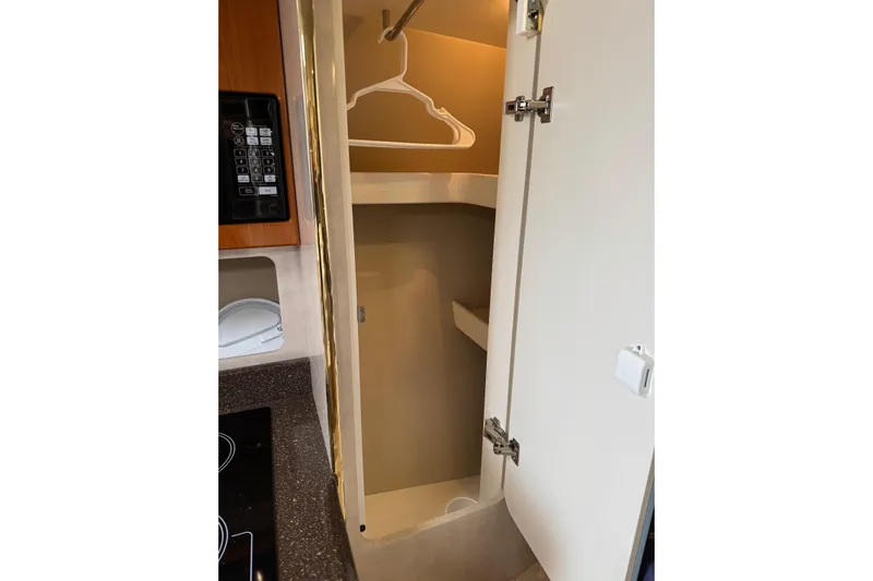  Yacht Photos Pics 2003 Formula 37 Performance Cruiser interior closet with microwave and countertop.