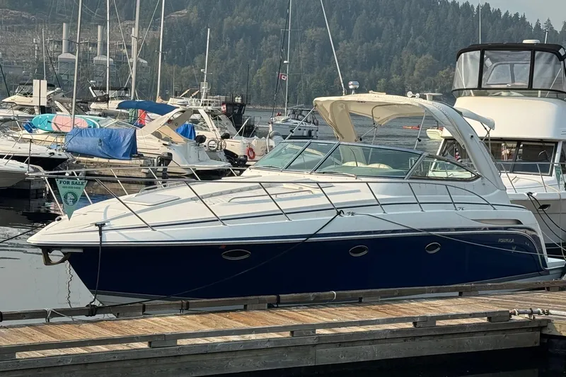  Yacht Photos Pics 2003 Formula 37 Performance Cruiser docked at marina, surrounded by other boats.