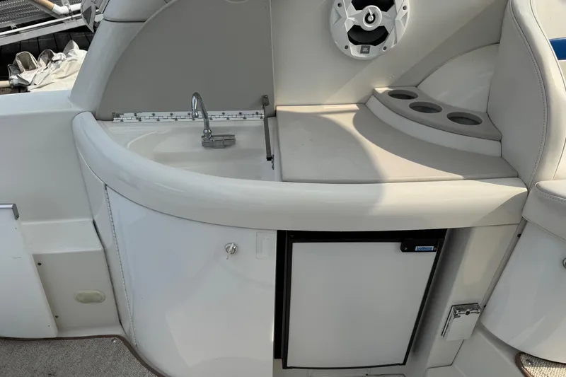  Yacht Photos Pics 2003 Formula 37 Performance Cruiser interior with sink, speaker, and cup holders.