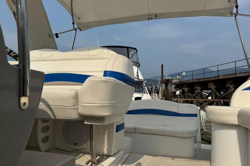  Yacht Photos Pics 2003 Formula 37 Performance Cruiser interior with white and blue seating at a marina.