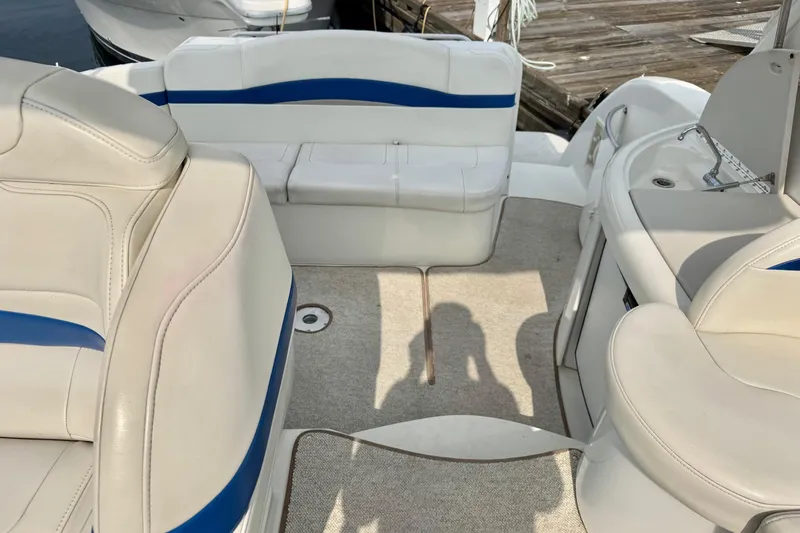  Yacht Photos Pics 2003 Formula 37 Performance Cruiser interior with white and blue seating, docked at marina.