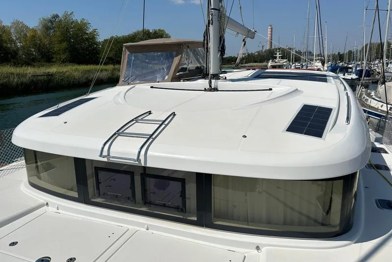 My Way Yacht Photos Pics 2017 Lagoon 39 catamaran with solar panels and sleek design in a marina setting.