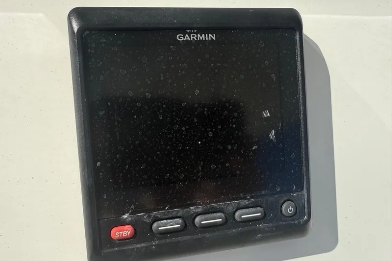  Yacht Photos Pics Garmin display on 2017 Regulator 25 boat, featuring control buttons and standby mode.