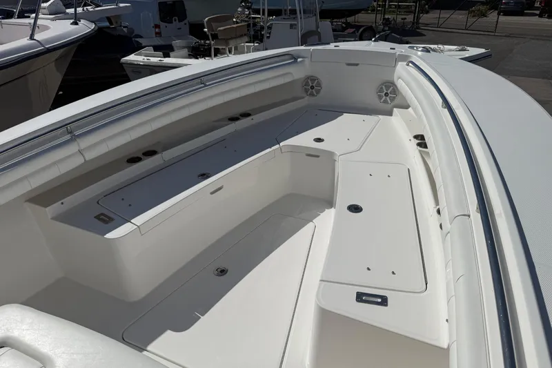  Yacht Photos Pics 2017 Regulator 25 boat interior with spacious seating and storage compartments.