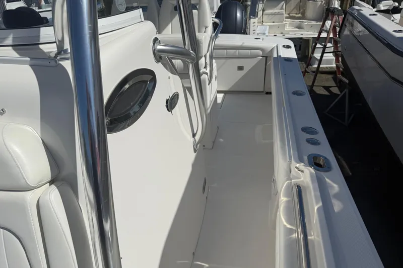  Yacht Photos Pics 2017 Regulator 25 boat interior with white seating and stainless steel fixtures.