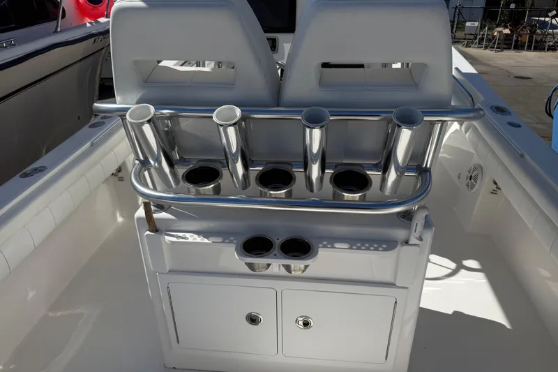  Yacht Photos Pics 2017 Regulator 25 boat interior with rod holders and storage compartments.