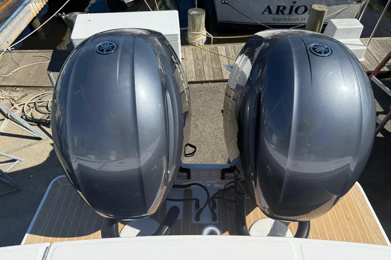  Yacht Photos Pics Twin Yamaha outboard engines on a 2017 Regulator 25 boat at a dock.