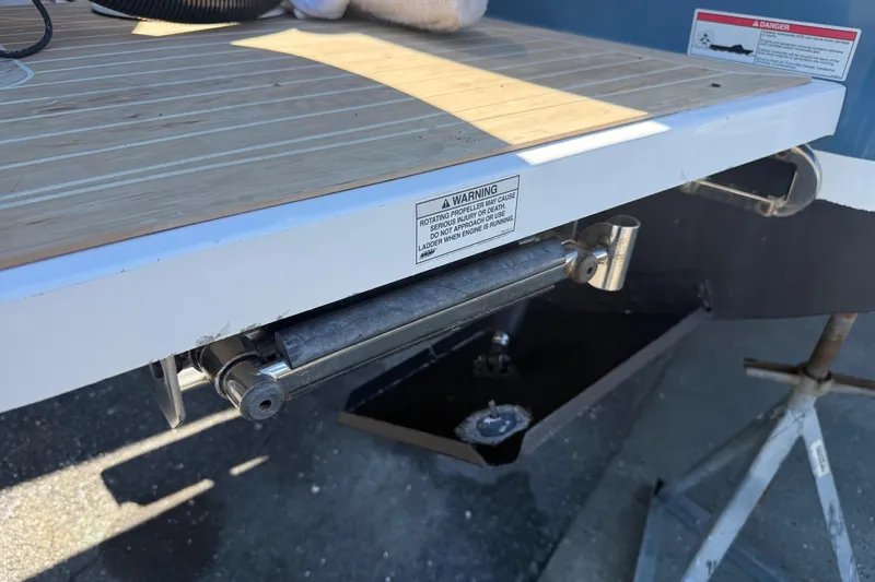  Yacht Photos Pics 2017 Regulator 25 boat swim platform with warning label and ladder mechanism.