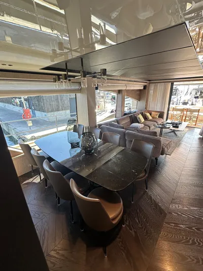  Yacht Photos Pics Luxurious interior of 2023 Cranchi Settantotto 78 yacht with elegant dining and seating area.
