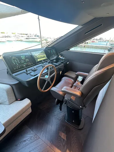  Yacht Photos Pics 2023 Cranchi Settantotto 78 yacht helm with modern controls and luxurious seating.