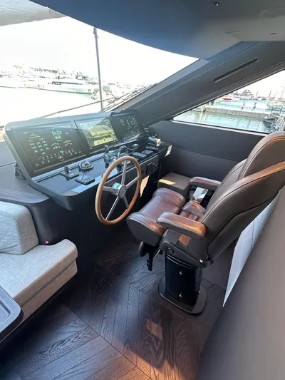  Yacht Photos Pics 2023 Cranchi Settantotto 78 yacht helm with modern controls and luxurious seating.