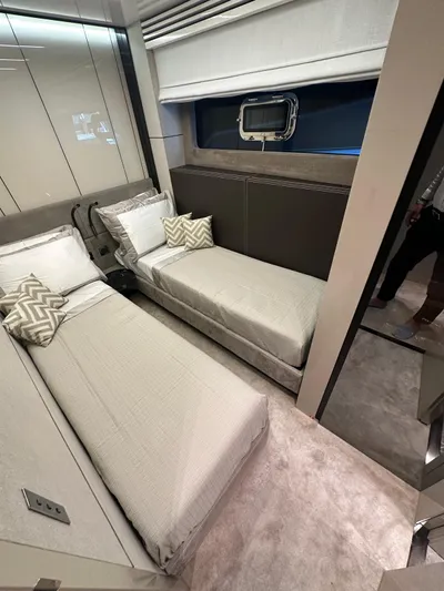  Yacht Photos Pics Luxurious cabin interior of 2023 Cranchi Settantotto 78 yacht with twin beds and modern decor.