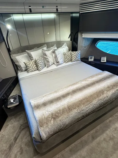  Yacht Photos Pics Luxurious bedroom interior of 2023 Cranchi Settantotto 78 yacht with elegant bedding and modern design.