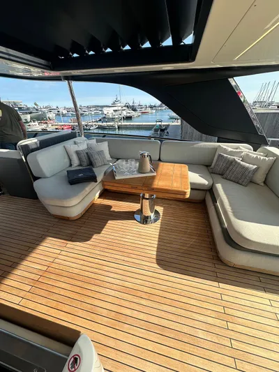  Yacht Photos Pics Luxurious 2023 Cranchi Settantotto 78 yacht deck with elegant seating and wooden table.