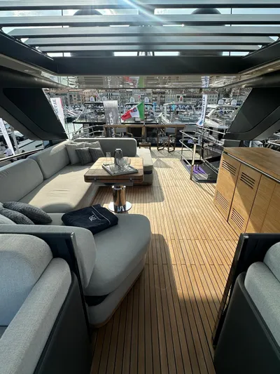  Yacht Photos Pics Luxurious 2023 Cranchi Settantotto 78 yacht interior with elegant seating and wooden flooring.