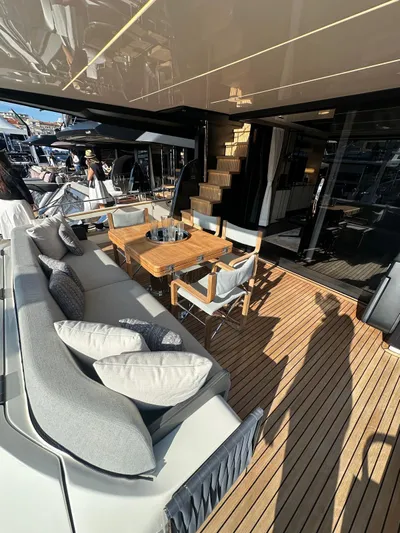  Yacht Photos Pics Luxurious 2023 Cranchi Settantotto 78 yacht deck with elegant seating and dining area.