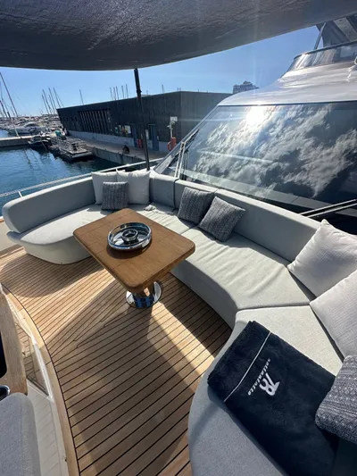  Yacht Photos Pics Luxurious 2023 Cranchi Settantotto 78 yacht with elegant outdoor seating and wooden deck.