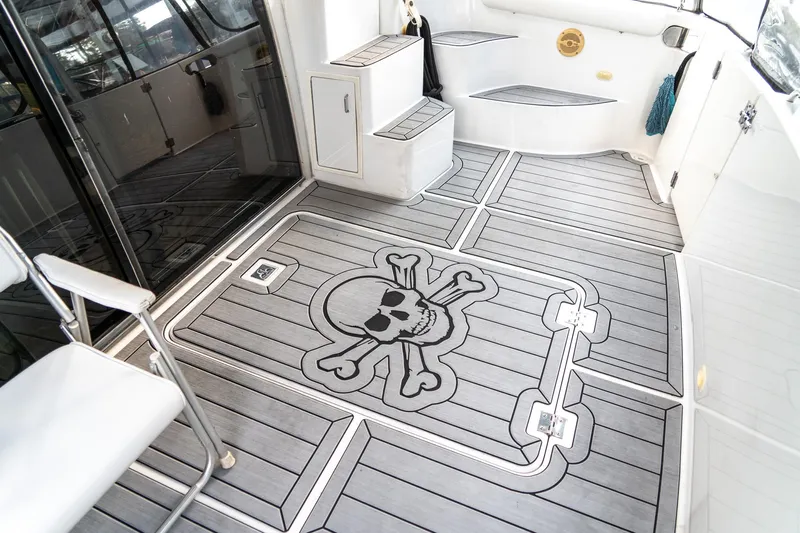 Yacht Photos Pics 2000 Carver 450 Voyager Pilothouse deck with skull and crossbones design.