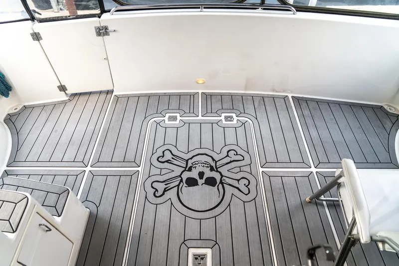  Yacht Photos Pics 2000 Carver 450 Voyager Pilothouse deck with skull and crossbones design.