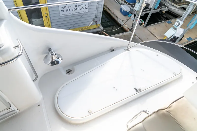 Yacht Photos Pics 2000 Carver 450 Voyager Pilothouse deck with chrome light and railing.