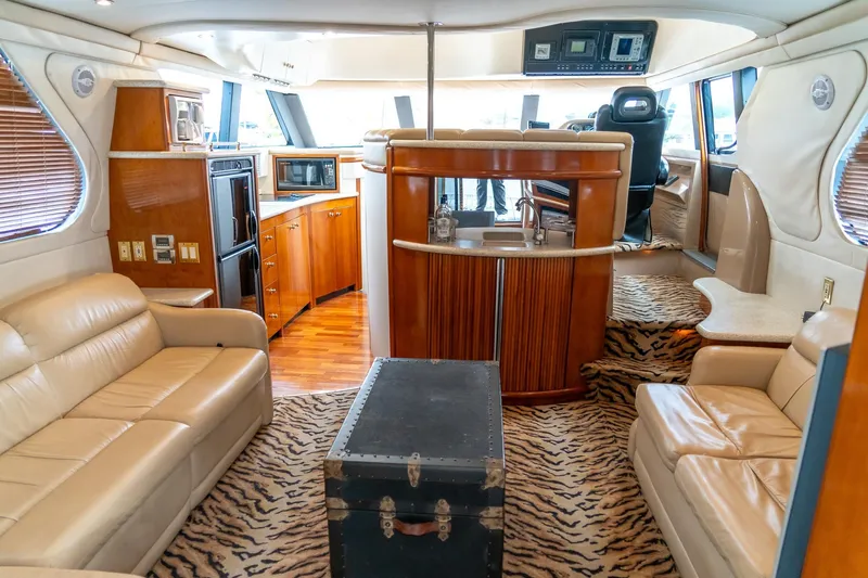  Yacht Photos Pics Luxurious interior of 2000 Carver 450 Voyager Pilothouse with leather seating and wood accents.