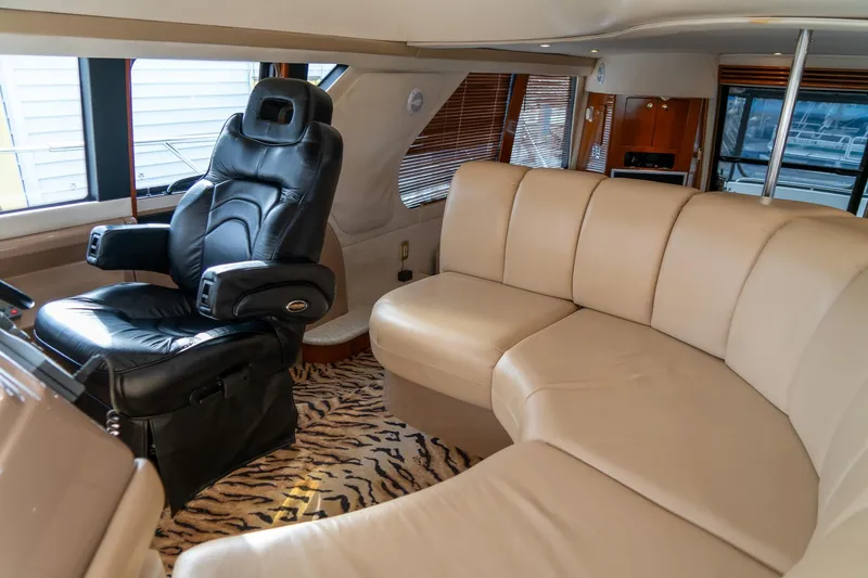  Yacht Photos Pics Luxurious interior of 2000 Carver 450 Voyager Pilothouse with leather seating and captain's chair.