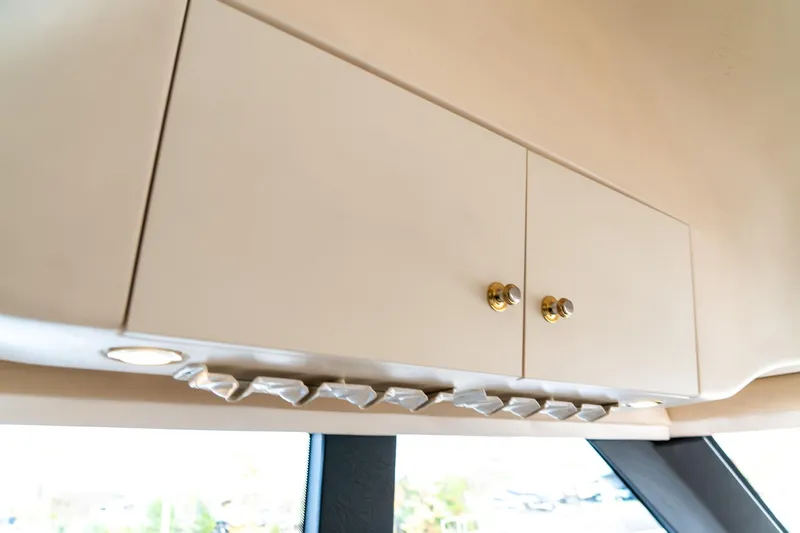  Yacht Photos Pics Cabinet interior of 2000 Carver 450 Voyager Pilothouse with modern lighting.