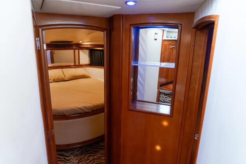  Yacht Photos Pics Interior of 2000 Carver 450 Voyager Pilothouse with cozy bedroom and wooden accents.