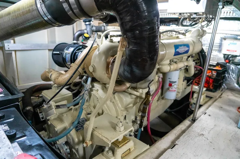  Yacht Photos Pics Engine room of a 2000 Carver 450 Voyager Pilothouse yacht, showcasing detailed machinery.