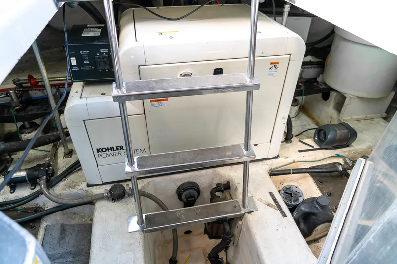  Yacht Photos Pics Engine room of 2000 Carver 450 Voyager Pilothouse with Kohler power system and ladder.