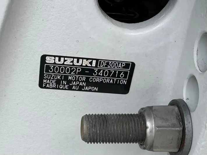  Yacht Photos Pics Label on Suzuki DF300AP engine, serial number 30002P-340716, made in Japan.