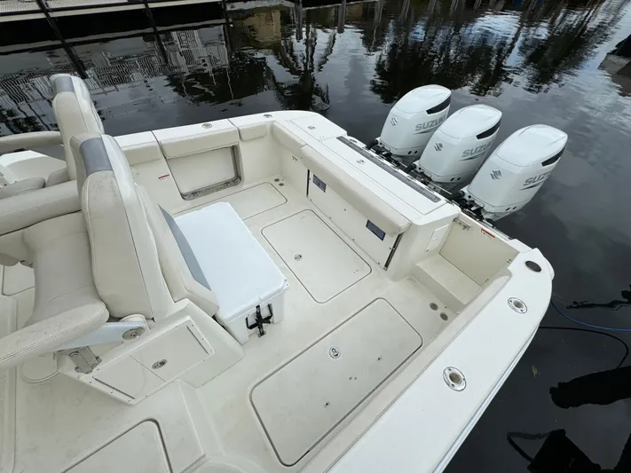  Yacht Photos Pics 2010 Hydra-Sports 3500 VX boat with triple outboard engines, spacious deck, and seating area.