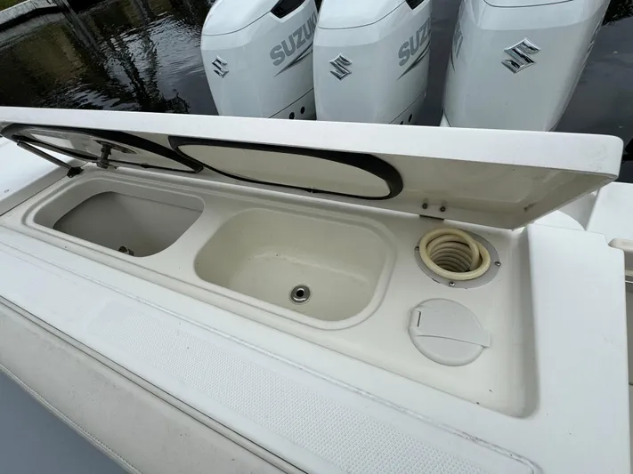  Yacht Photos Pics 2010 Hydra-Sports 3500 VX boat with open storage compartment and Suzuki outboard engines.