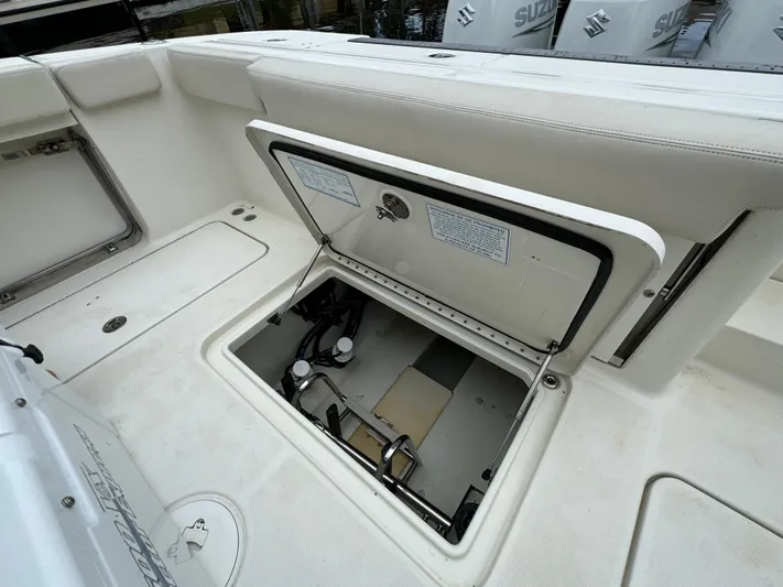  Yacht Photos Pics 2010 Hydra-Sports 3500 VX boat storage compartment open, showcasing interior details.