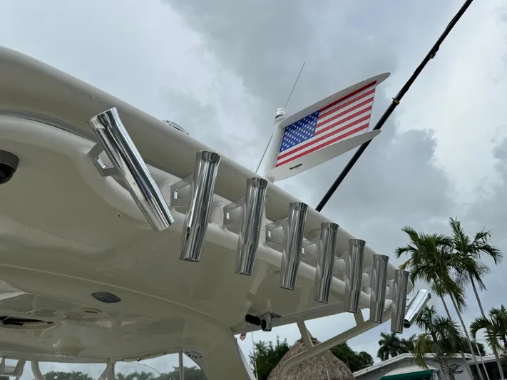  Yacht Photos Pics 2010 Hydra-Sports 3500 VX boat with rod holders and American flag, under cloudy sky.