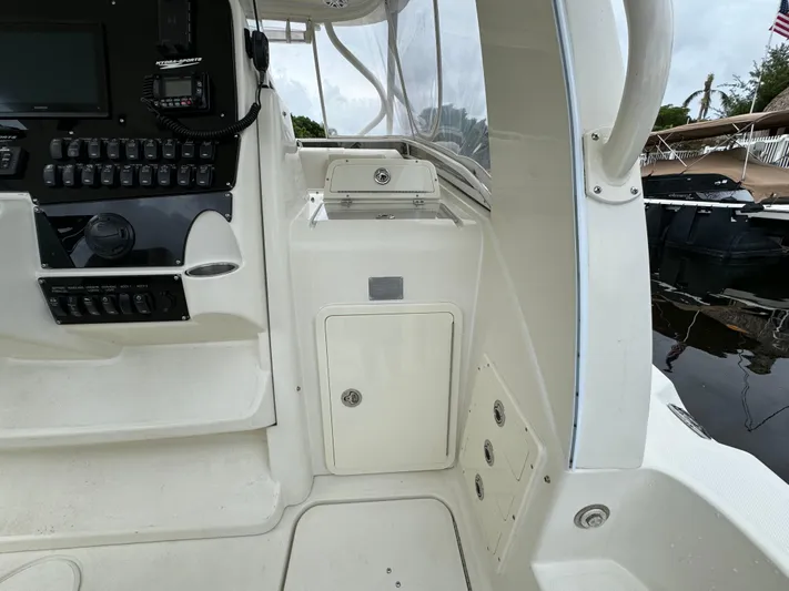  Yacht Photos Pics 2010 Hydra-Sports 3500 VX boat interior with control panel and storage compartments.
