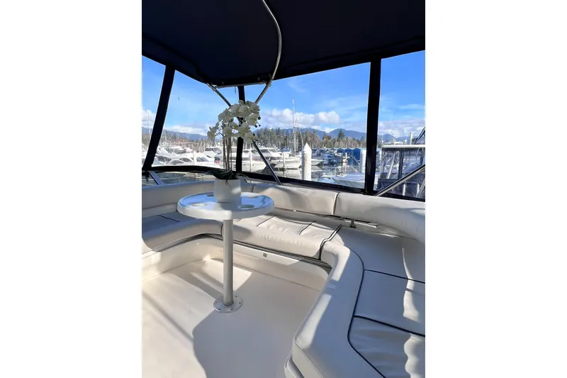 Rising Tide Yacht Photos Pics Interior of 1996 Sea Ray 400 Sedan Bridge yacht with marina view.