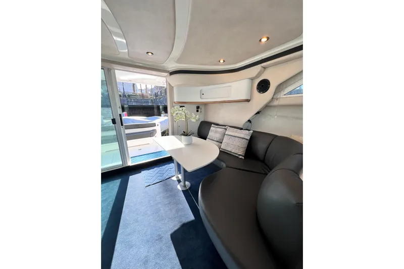 Rising Tide Yacht Photos Pics Luxurious interior of 1996 Sea Ray 400 Sedan Bridge yacht with plush seating and elegant decor.