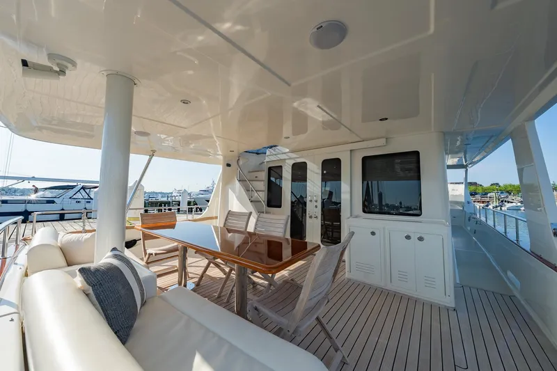 Dash Yacht Photos Pics Luxurious 2016 Grand Banks 72 Aleutian RP yacht deck with elegant seating and dining area.