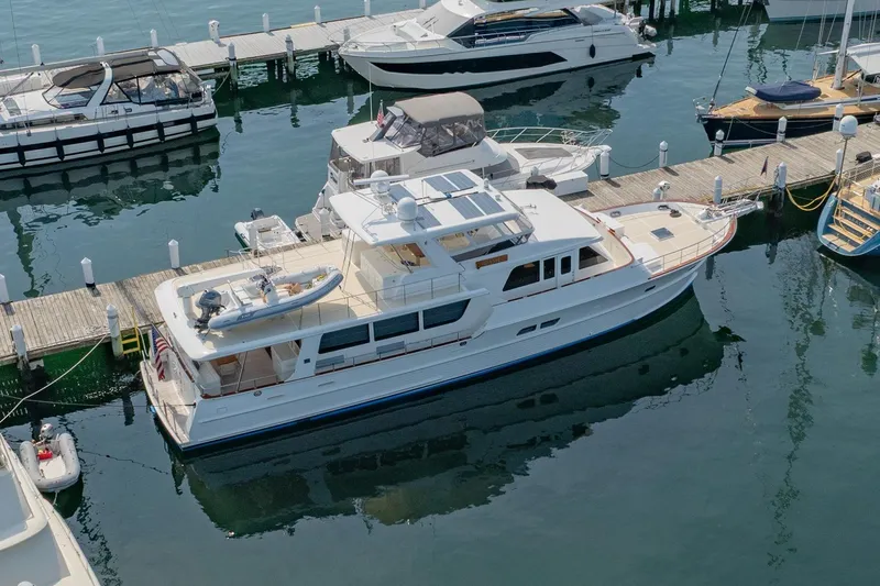 Dash Yacht Photos Pics 2016 Grand Banks 72 Aleutian RP yacht docked at marina, aerial view.