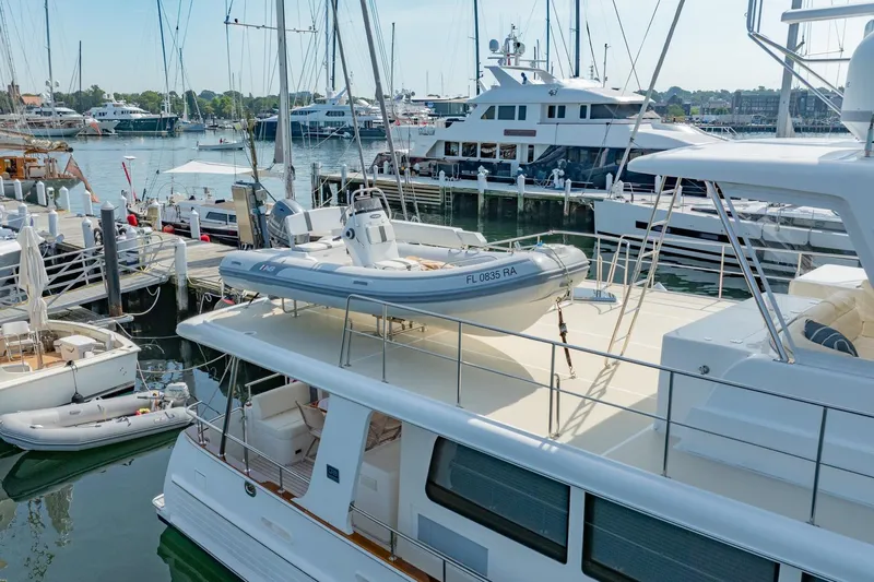 Dash Yacht Photos Pics 2016 Grand Banks 72 Aleutian RP yacht docked with tender on deck.