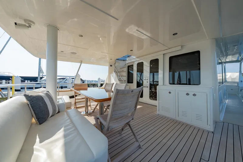 Dash Yacht Photos Pics Luxurious 2016 Grand Banks 72 Aleutian RP yacht deck with seating and dining area.