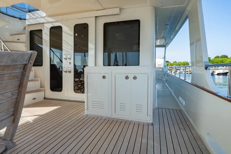 Dash Yacht Photos Pics 2016 Grand Banks 72 Aleutian RP yacht deck with elegant wood flooring and sleek design.